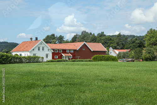 Wallpaper Mural A white house with a black roof sits in a grassy field in Norway Torontodigital.ca
