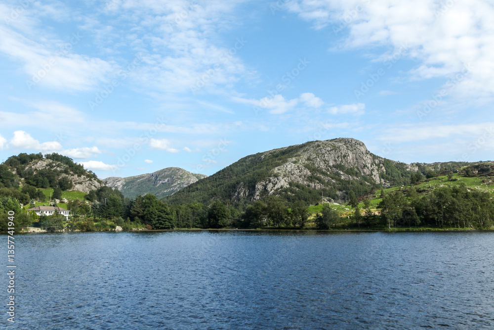 A calm lake with a mountain in the background in Norway fjord land A calm lake with a mountain in the background in Norway fjord land