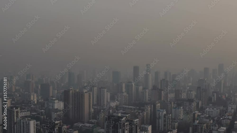 Dense smog blanketing sprawling metropolitan skyline, obscuring high rise buildings and revealing severe atmospheric pollution impacting urban environments Dense smog blanketing sprawling metropolitan skyline, obscuring high rise buildings and revealing severe atmospheric pollution impacting urban environments