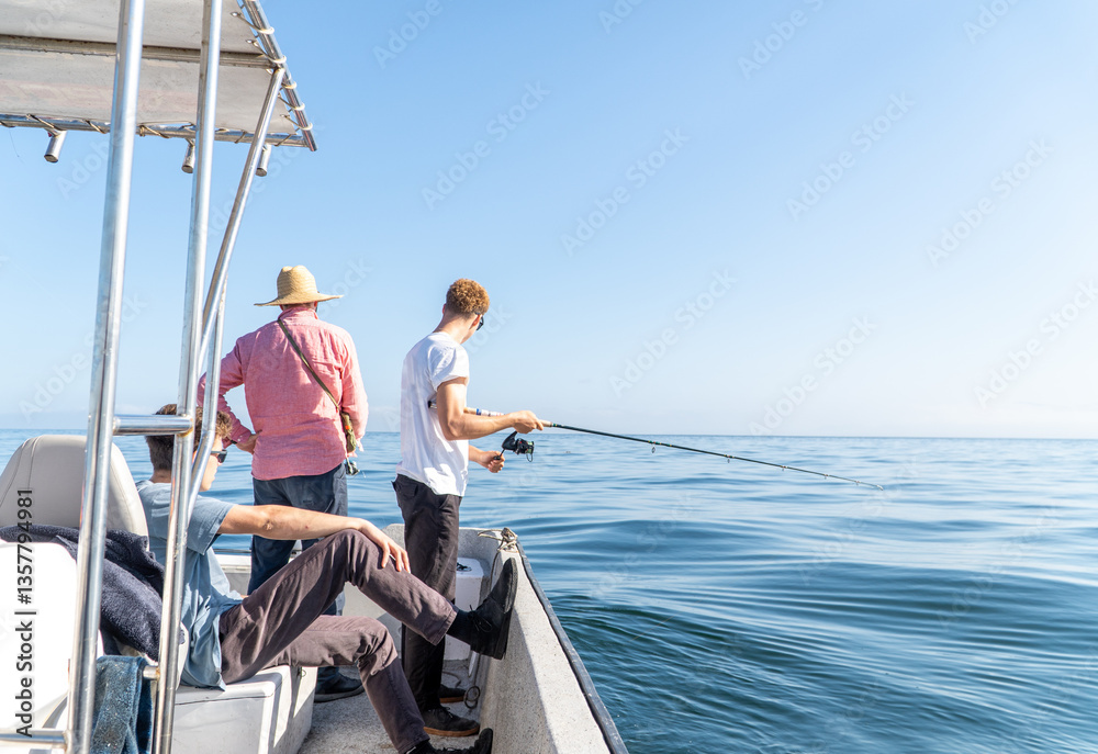 Three men fishing from a boat on the open sea