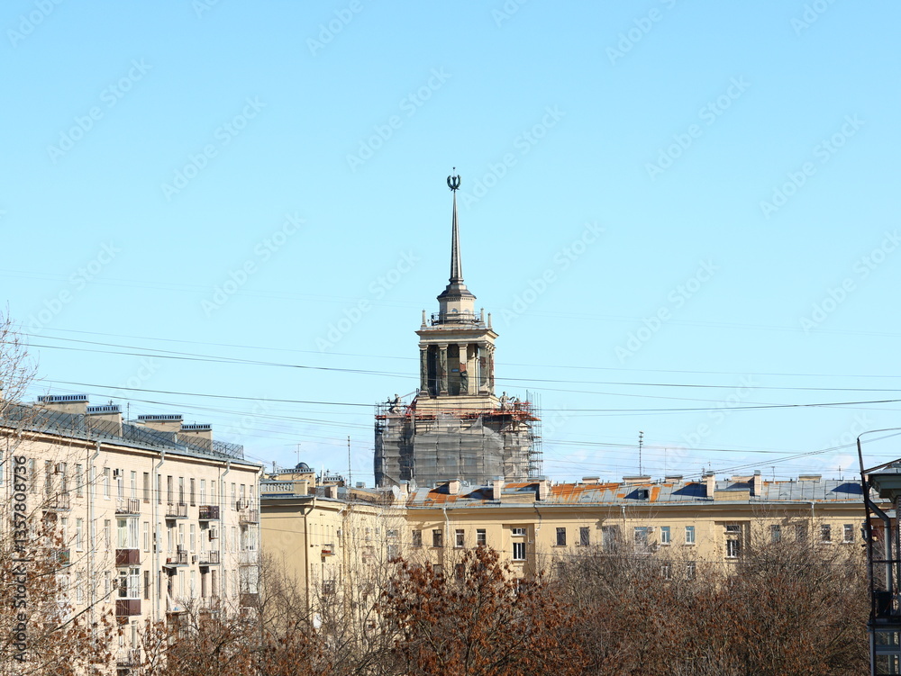 A Historic Building Featuring a Spire Currently Undergoing Renovation in an Urban Landscape A Historic Building Featuring a Spire Currently Undergoing Renovation in an Urban Landscape