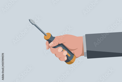 Hand holding a screwdriver