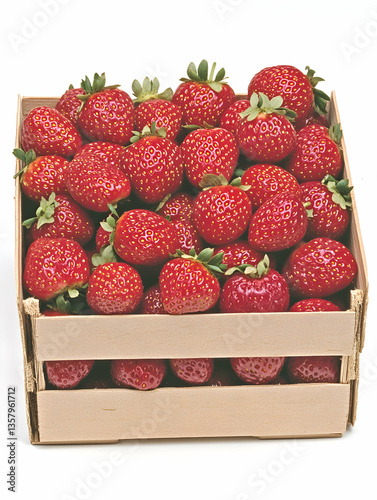 Fresh, ripe strawberries in a wooden crate photo