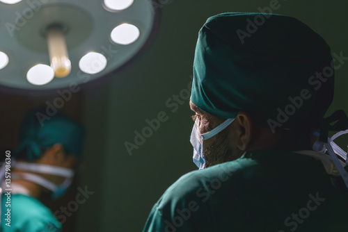 tired male caucasian doctor break operating. specialist surgical man exhausted working hard doing surgery rest in the back. male surgeon wearing uniform have break from working in emergency operation