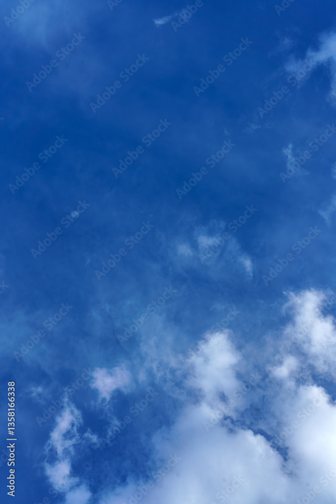 Obraz premium Osaka, Japan - Sep 25 2024, vertical view of the blue sky with different types of clouds, at daytime, Osaka, Japan