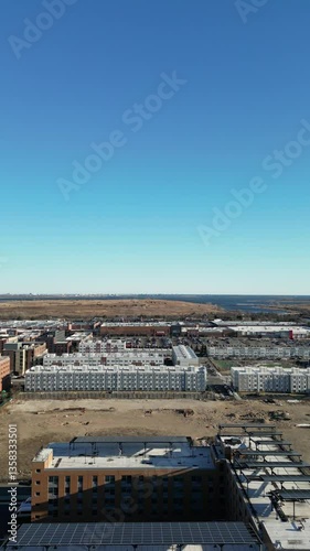 Aerial view over Brooklyn featuring Belt Parkway, Shirley Chisholm State Park, Spring Creek Beach, Pennsylvania Ave, Flatlands Ave, and Howard Beach.