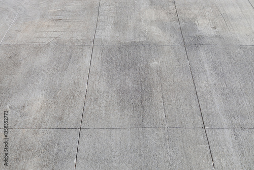 Full frame abstract texture background of a Rustic gray cement walking path with large rectangular lines