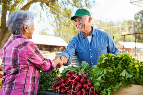 Happy Farmer and Senior Woman Shaking Hands at Farmers Market