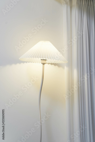 minimal style of a white lamp and white curtain