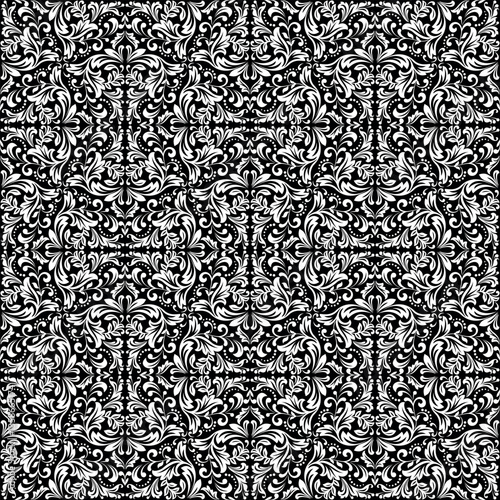 Wallpaper in the style of Baroque. White and black floral ornament. Seamless vector background. Graphic pattern for fabric, wallpaper, packaging. Ornate Damask flower illustration.