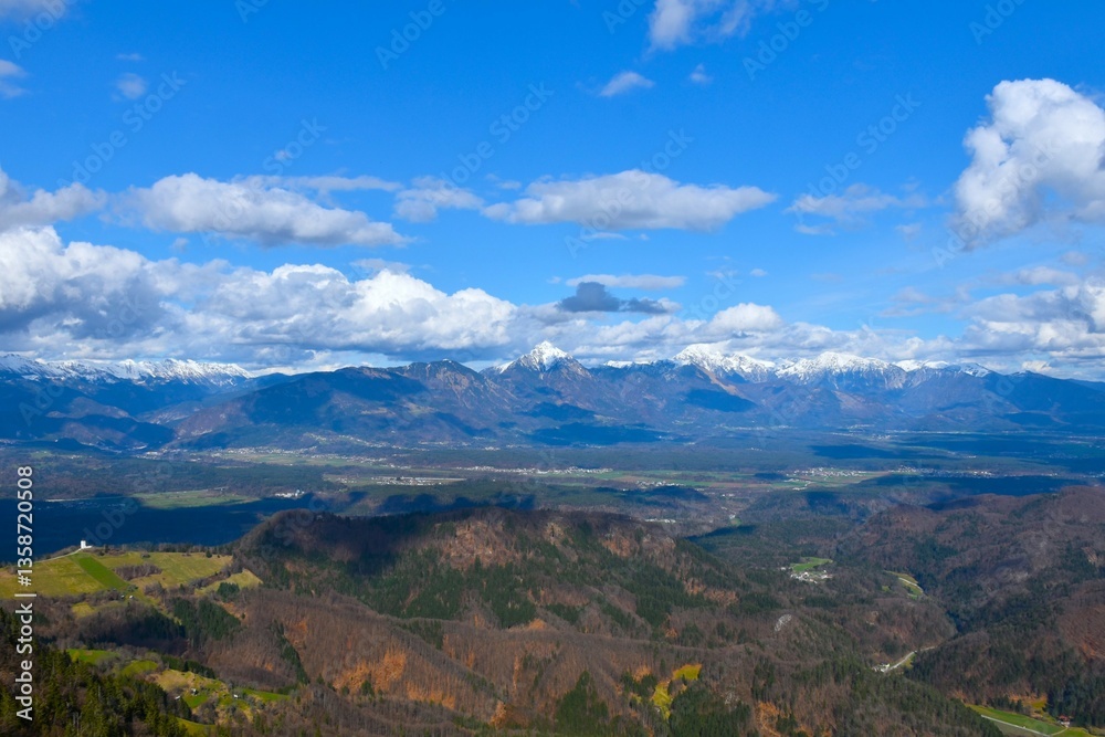 Fototapeta premium Panoramic view of snow covered mountain peaks in Gorenjska, Slovenia