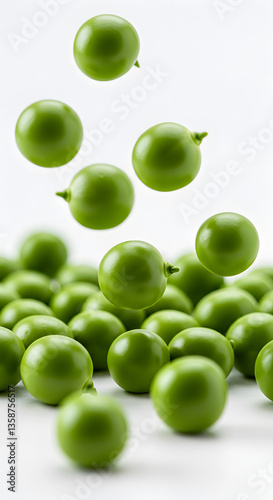 Green Peas Falling on White Background
