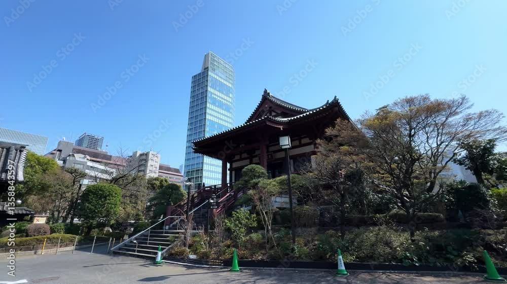 A traditional Japanese temple contrasts against modern skyscrapers in Tokyo, Japan A traditional Japanese temple contrasts against modern skyscrapers in Tokyo, Japan