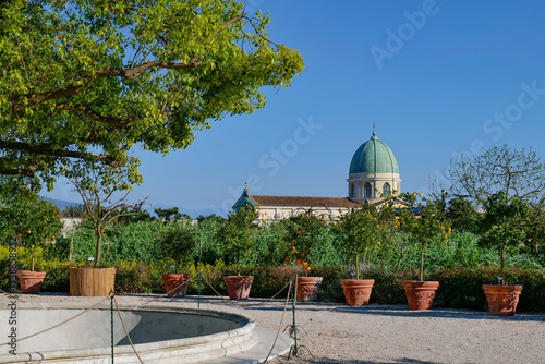 Obraz na płótnie The dome of a church seen from the garden of Capodimonte park in Naples, Italy. w salonie