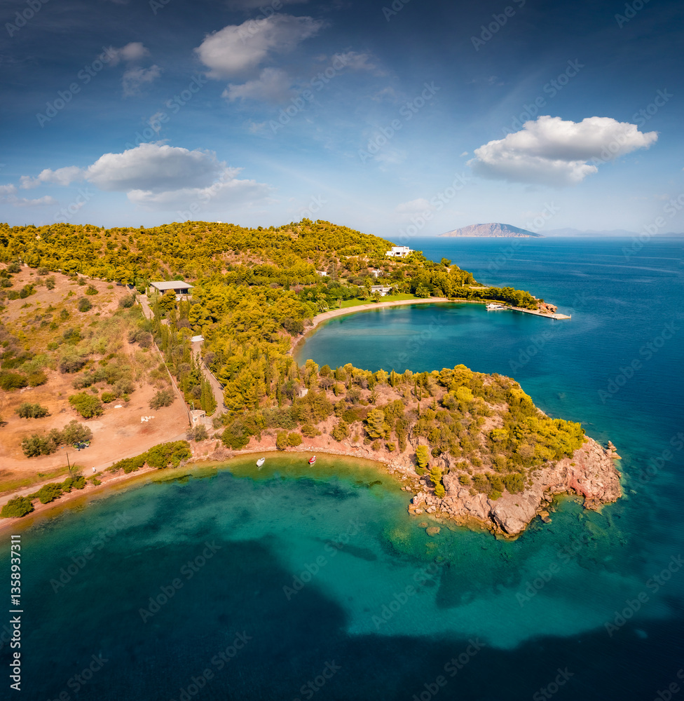 Amazing summer view from flying drone of Thini greek resort. Picturesque morning scene of Peloponnese peninsula, Greece, Europe. Aerial seascape of Myrtoan Sea. Vacation concept background..