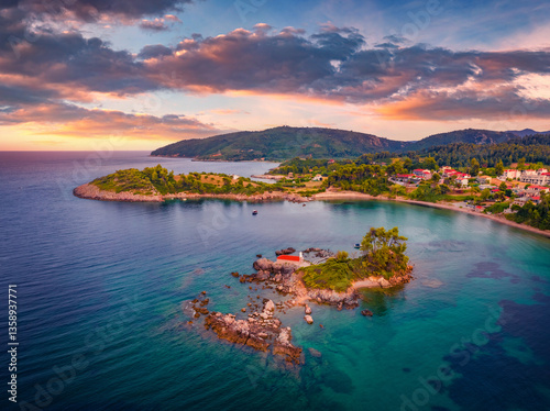 Obraz na płótnie Picturesque evening scene of Saint Nicholas church and Ag. Nikolaos village. Great sunset on Euboea island, Greece, Europe. Amazing summer seascape of Aegean sea. Traveling concept background. w salonie