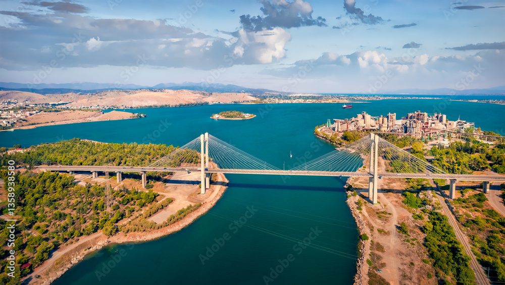 Aerial summer view of High Bridge Evripos. Wonderful morning cityscape of Chalcis town, Greece. Spectacular seascape of Aegean sea, North Euboean Gulf. Traveling concept background.