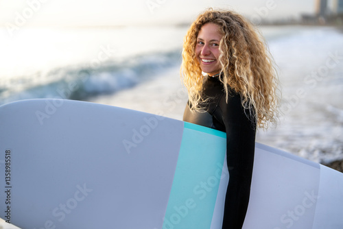 Photography Portrait of a young happy woman, surfing and enjoying summer vacation on the bea