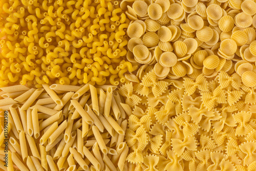 Pasta. Various kinds of uncooked pasta , top view . Pasta background .
