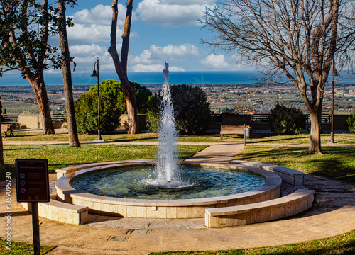 Panoramic view of Piazzale Belvedere and its fountain in the municipality of Castagneto Carducci Tuscany Italy photo