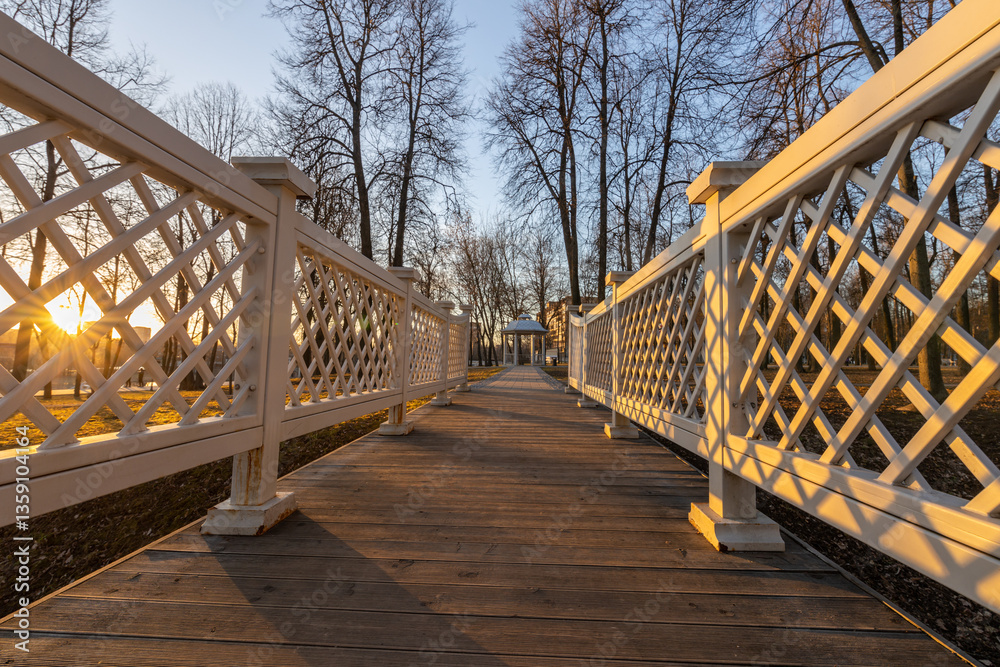 Fototapeta premium A wooden walkway with a lattice fence on either side