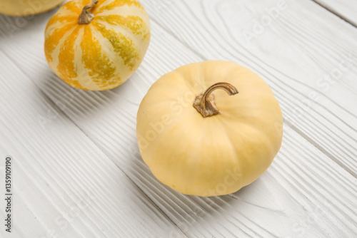 Mini pumpkins and gourds on...