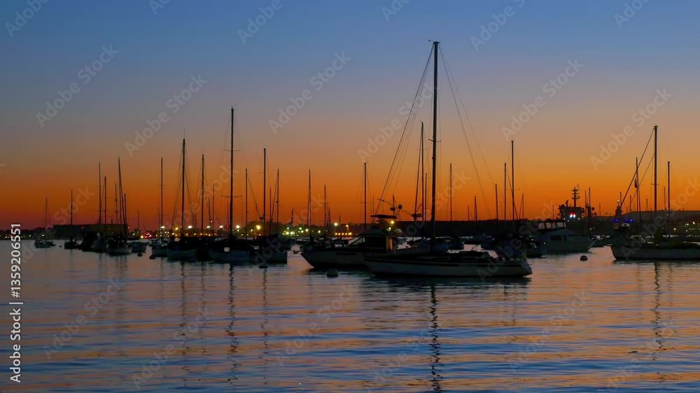 Marina at sunset with boats and city lights in 4K Marina at sunset with boats and city lights in 4K