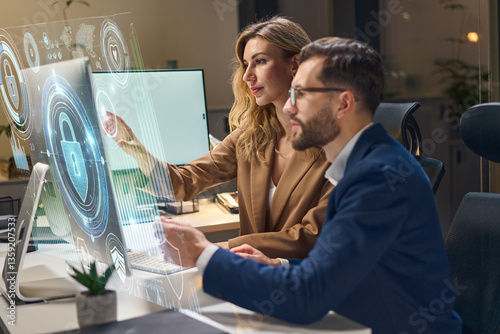 Team Discussing Cybersecurity Strategies Using Interactive Technology In Modern Office Environment