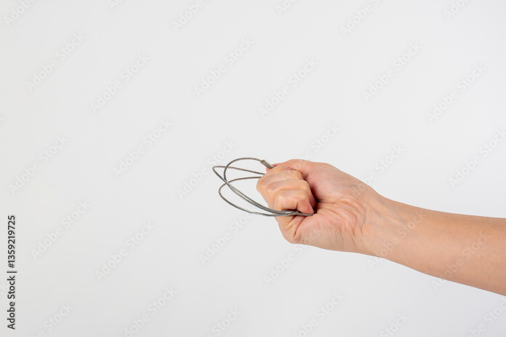 Wire rope in hand isolated on white background. Wire rope in hand isolated on white background.