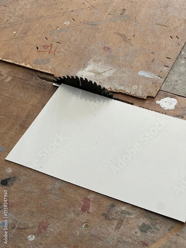 Table Saw Blade Emerging Through a Workbench for Precision Cutting.