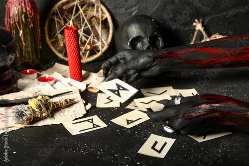 Bloody witch hands with Eld...