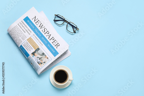 Newspaper, eyeglasses and c...