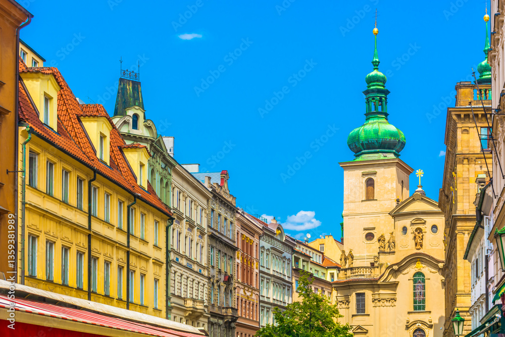 Obraz premium View of the architectural details of the Church of St. Gall, showcasing its intricate facade, and surrounding street with notable landmarks that reflect the rich cultural heritage of the area