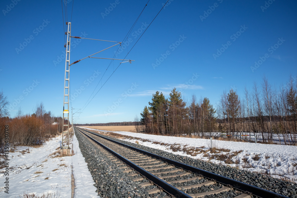 Fototapeta premium Empty train tracks in early springtime, Kempele Finland