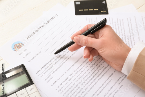 Woman filling out house ren...