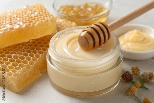 Honey-infused skincare cream jar with honeycomb and honey drizzle