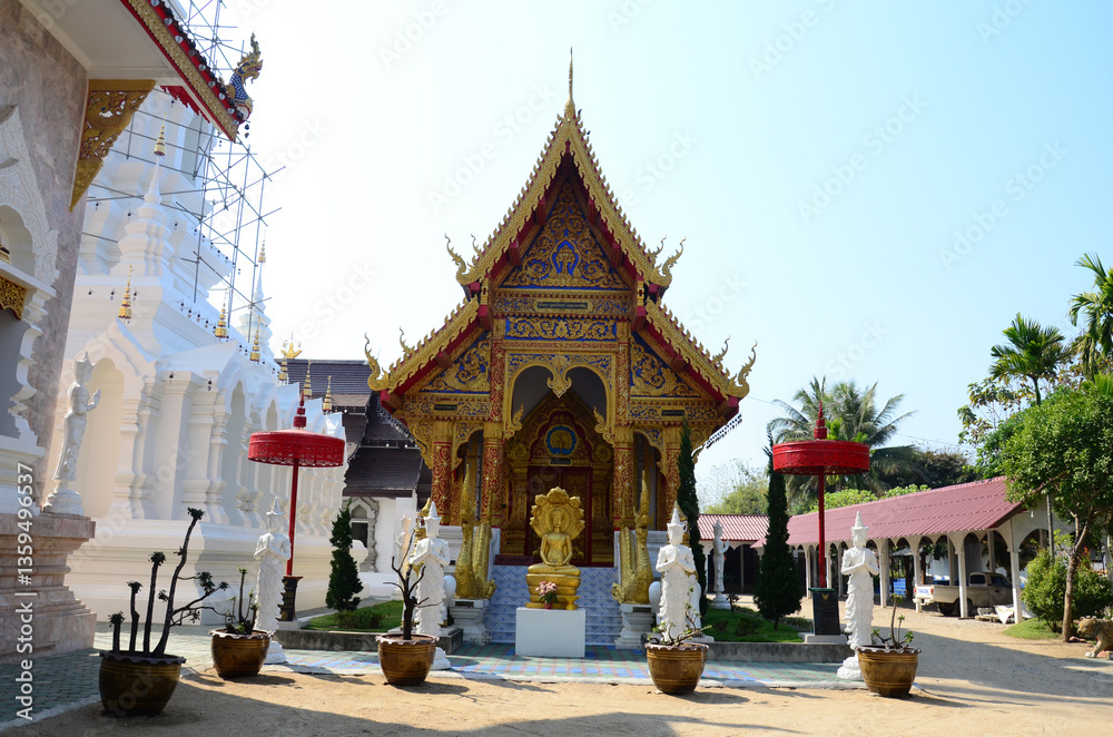 Fototapeta premium Ancient ordination hall or antique old ubosot for thai travelers people travel visit and respect praying blessing buddha wish myth at Wat Khua Khrae temple on February 22, 2015 in Chiang Rai Thailand