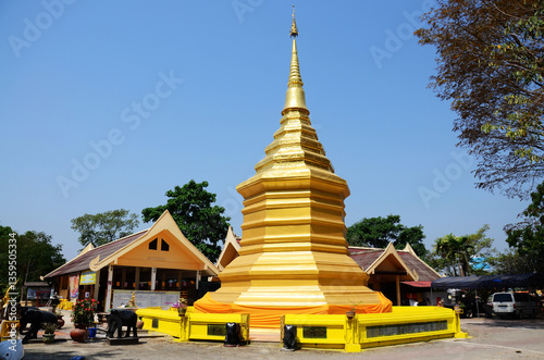 Ancient chedi or antique old stupa Buddhadhatu Pagoda for thai people travelers travel visit and respect praying wish at Wat Phra That Doi Chom Thong temple on February 22, 2015 in Chiang Rai Thailand photo