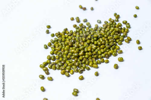 Fotografie Ample amount of Green Moong Dal beans Isolated on a white background