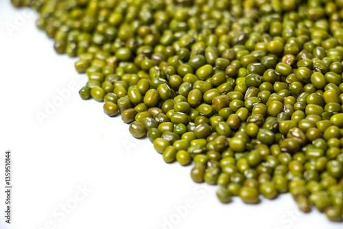 Obraz na plátně Horizontal shot of Green Moong Dal beans Isolated on a white background