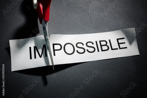 Obraz na plátně Scissors cutting the word impossible to make possible concept for self belief, p