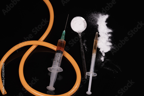 Syringe with drugs dose on black background. Narcotic substances in spoon. Drugs concept on dark place. addiction and bad habits. Heroin narcotic crime. Danger addict problem criminal