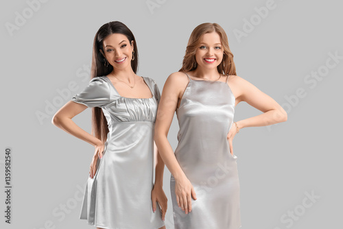 Stylish young women in dres...