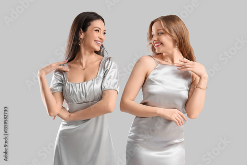 Two happy young women in el...
