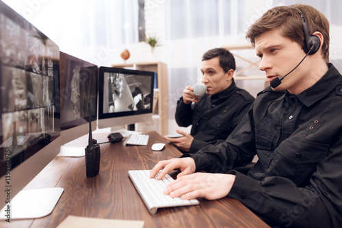 Two men work as guards.