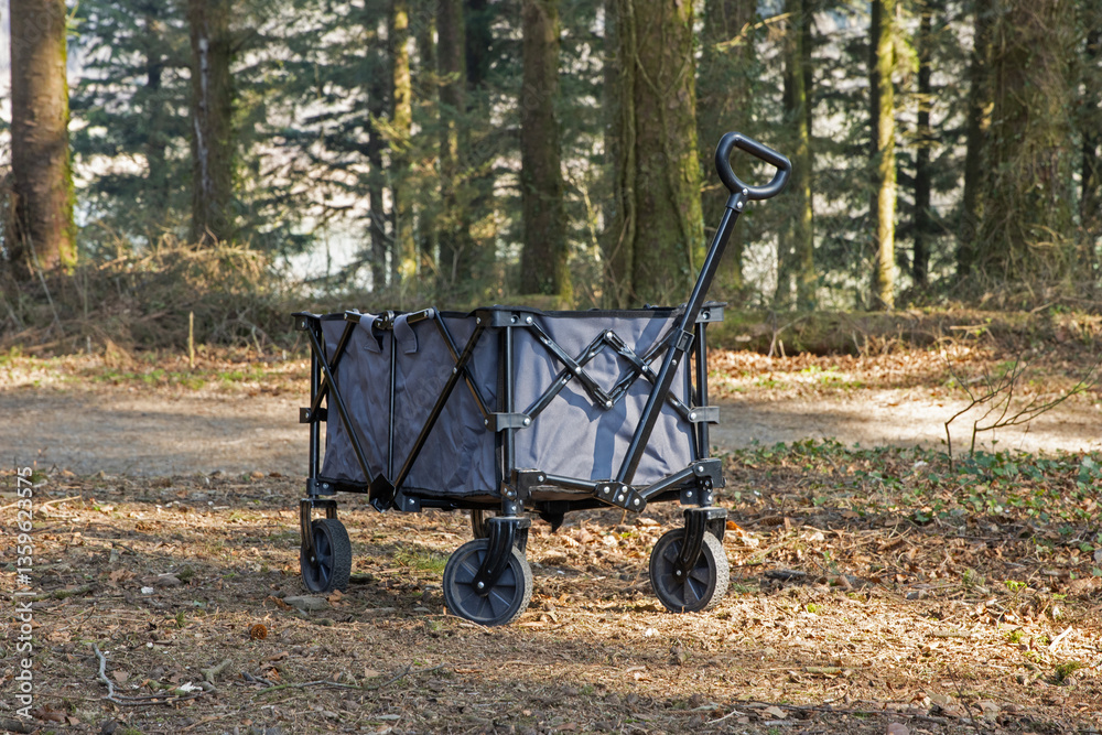 Wheeled camping trailer going through forest