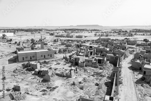 View of the small village Raghba with the abandoned mud houses in the middle of the desert in Saudi Arabia
