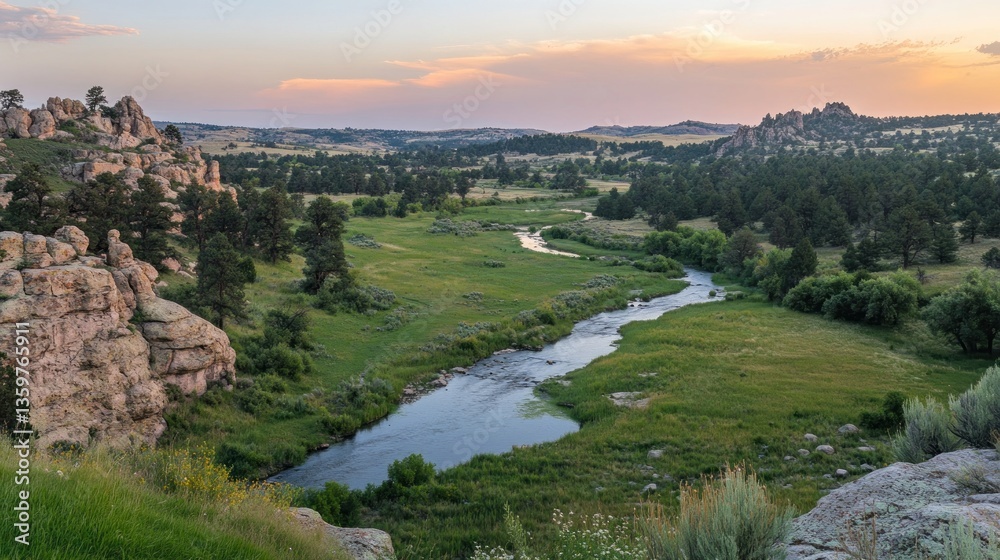Fototapeta premium Scenic landscape featuring a river winding through lush greenery and rocky formations at sunset.