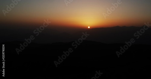 Beautiful warm sunset in Turkish mountains of the Kemer Region shot from the observation deck on Tahtali Mountain.