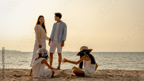 Happy family beach vacations.Group of multi generation family little girl with parents and grandparents relax and enjoy together on the beach.